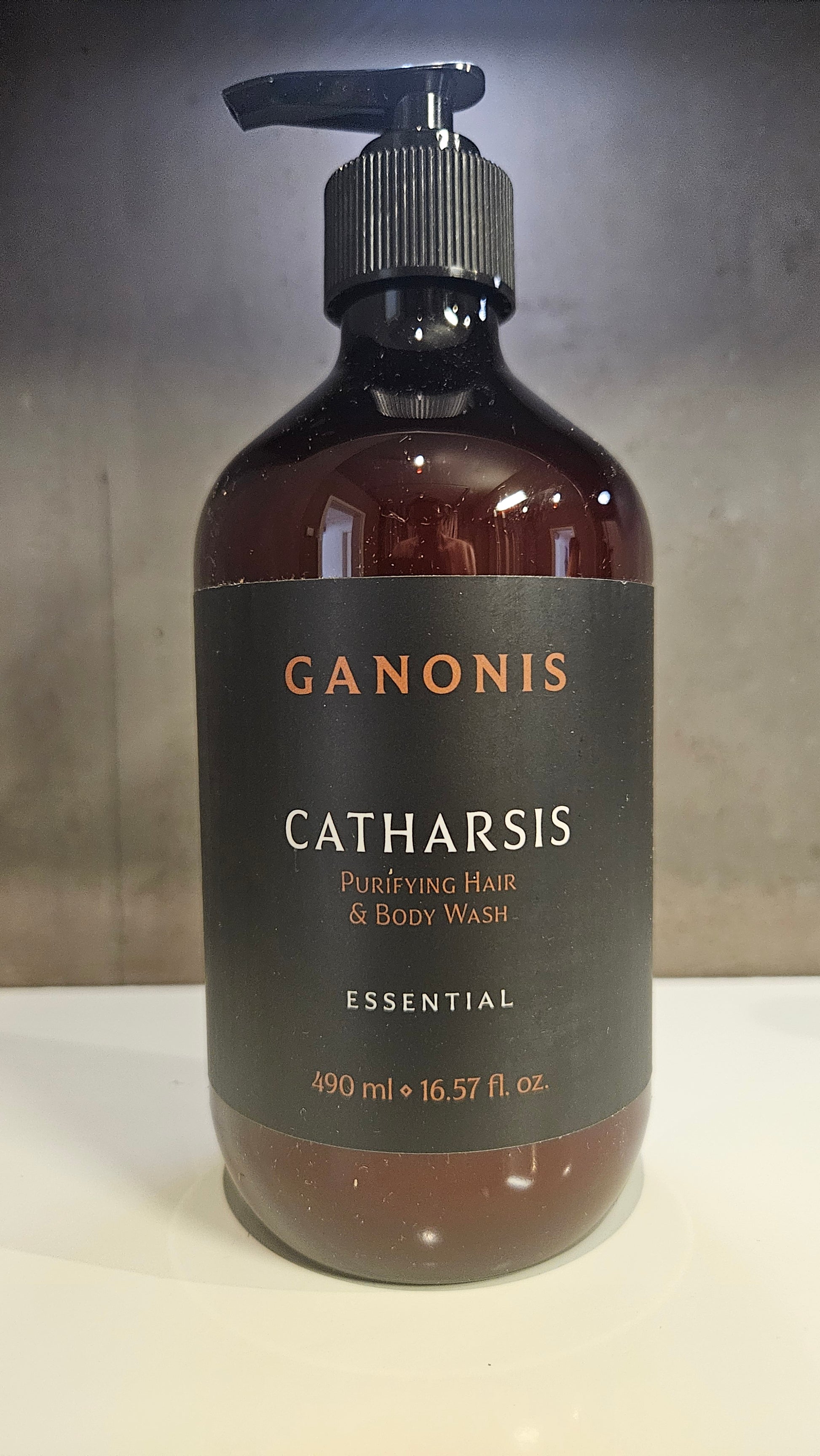 Bottle of GANONIS Catharsis Purifying Hair & Body Wash on a white surface
